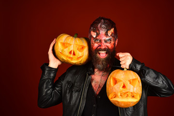 Devil or monster with October decorations. Demon with evil smile
