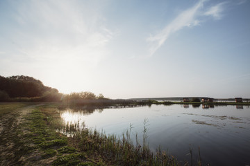 beautiful lake shore on the background of a wooden bridge