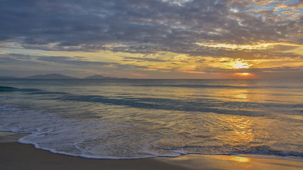Sea waves and beautiful sunset