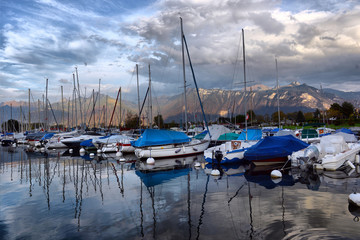 Fototapeta na wymiar SWISS, LAKE GENEVA, 21, OCTOBER, 2017,Yachts on autumn parking lot on Lake Geneva, SWISS, LAKE GENEVA, 21, OCTOBER, 2017