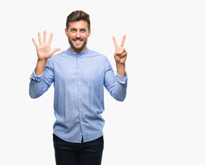 Fototapeta premium Young handsome man over isolated background showing and pointing up with fingers number seven while smiling confident and happy.