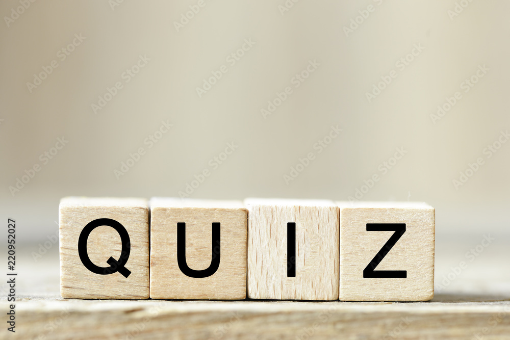 Poster quiz. wooden cube block building the word quiz
