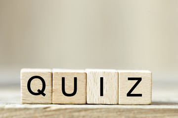 QUIZ. Wooden cube block building the word QUIZ