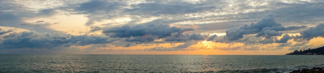 Naklejka na ściany i meble Beautiful sunset over the ocean and sunshine