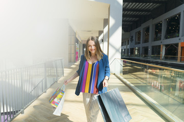 sale concept. woman with a shopping bags. Beautiful woman at the shopping center with bags.