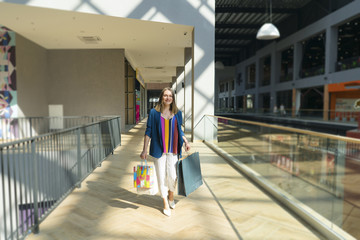 sale concept. woman with a shopping bags. Beautiful woman at the shopping center with bags.