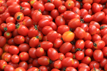 Piles of tomatoes in a market