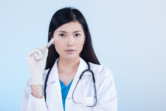 Doctor Nurse in white blue shirt with stethoscope and rubber gloves