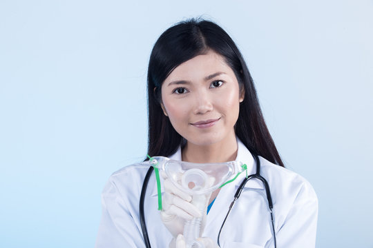 Doctor Nurse in white blue shirt with stethoscope and rubber gloves