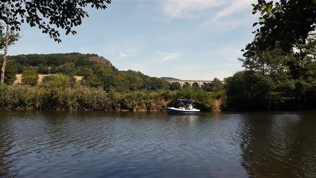 Boat on a river in Clecy, Normandy France
