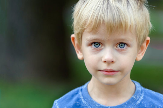 Portrait of a blond boy - 4 years old after tears, copy space