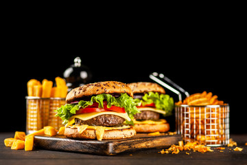 Delicious grilled burgers © George Dolgikh