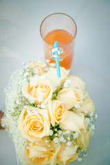 Hands newlyweds on  beautiful decorated wedding table. Wedding day. bridal bouquet on the table. Hands of newlyweds with wedding rings

