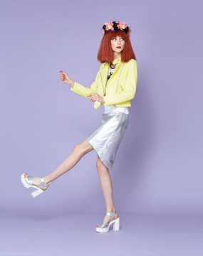Red haired model posing in vintage dress