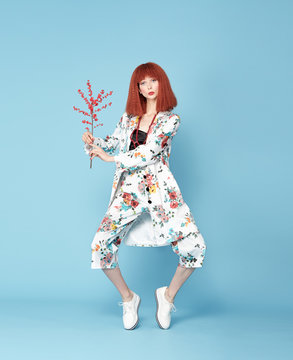 Red haired model posing in vintage dress