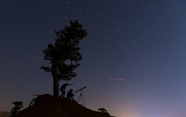 Obraz premium Telescope watching the wilky way ;sky curiosity and science