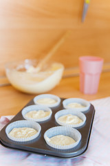 Fototapeta na wymiar a concept of baking sweet cupcakes and muffins at home