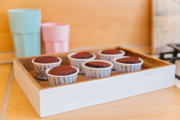 a concept of baking sweet cupcakes and muffins at home