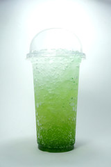 Italian soda kiwi soft drink in take home cup beverage for summer isolated on white background,clipping path.