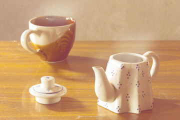 still life classic ceramic kettle with cup