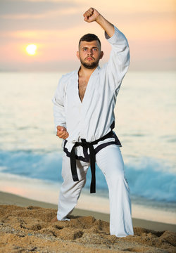 Man doing karate poses