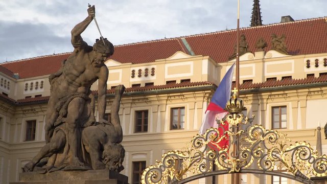Battling Titans statues at gate to First Courtyard with Hrad or Castle behind in Prague Czech Republic