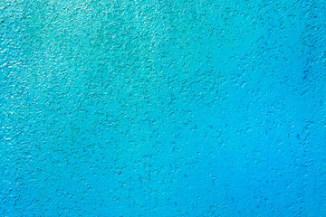 Iron wall painted in blue over the old paint