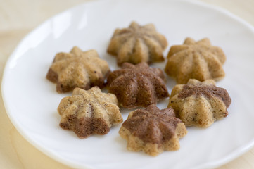 Cinnamon sandbakelse christmas cookies, two color, cocoa dark brown and vanilla light golden brown, delicious czech cookies