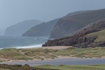 Sandwood Bay, Highlands of Scotland. Remote bay with white sand, dunes and reeds. Located on the...