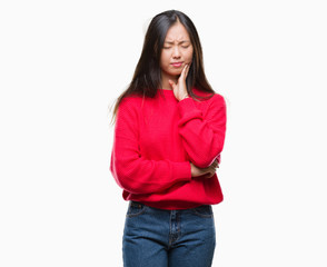 Young asian woman wearing winter sweater over isolated background touching mouth with hand with painful expression because of toothache or dental illness on teeth. Dentist concept.