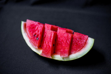 an image of a Fresh sliced red watermelon on a table