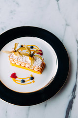 Beautiful dish of Millefeuilles French puff pastry on elegant plate