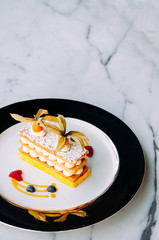 Beautiful dish of Millefeuilles French puff pastry on elegant plate