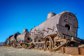 Old rusty locomotive abandoned in the train cemetery of Uyuni, Bolivia