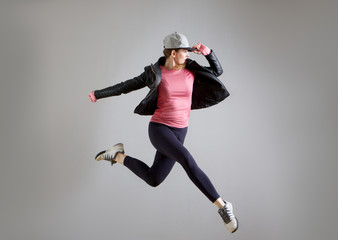 modern young woman jumping in the air