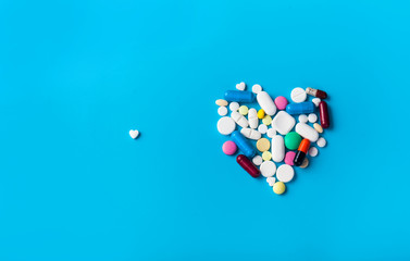 Assorted pharmaceutical medicine pills. Heart shape