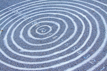 Fototapeta na wymiar Concentric circles and Arabia numbers on the ground