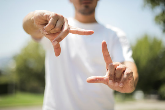 Male hands framing composition