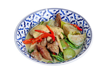 Green chicken curry in coconut milk with eggplant .