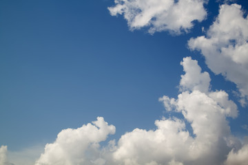 Naklejka na ściany i meble beautiful white clouds on blue sky background