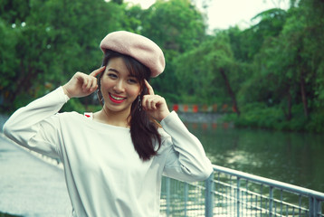 Beautiful girl teen smile and happy for traveling in public park.