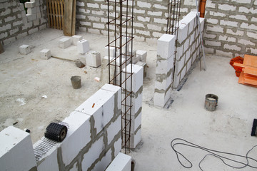 interior of a country house under construction. Site on which the walls are built of gas concrete...