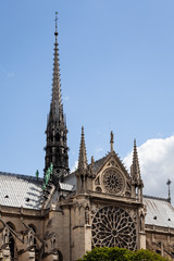 Fototapeta na wymiar Notre Dame Cathedral in Paris with a View of the South Rose Window and Spire