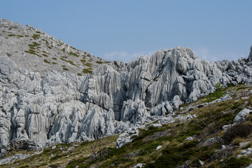 Fototapeta na wymiar Tulove grede are extraordinary karst phenomena within the Southern Velebit Mountain, Croatia. They are among highest natural rock pillars. Site of Winnetou filming.