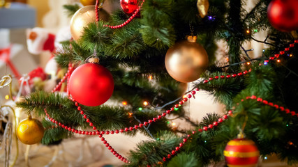 Fototapeta na wymiar Closeup photo of beautiful decorated Christmas tree in living room