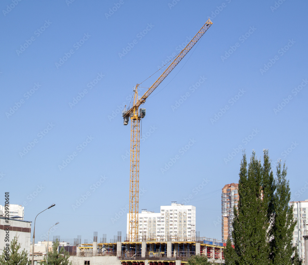 Poster example of point construction in a residential area. crane on the site of the building under constru