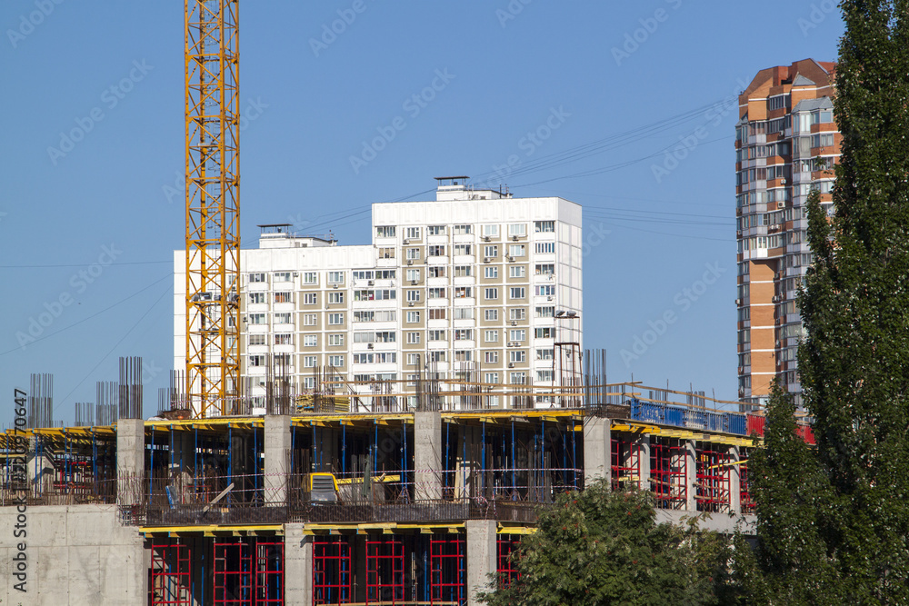 Poster example of point construction in a residential area. crane on the site of the building under constru