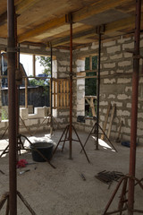 view of the wooden formwork with metal holders, which will be filled with the overlap between the floors in the country house under construction from the foam block