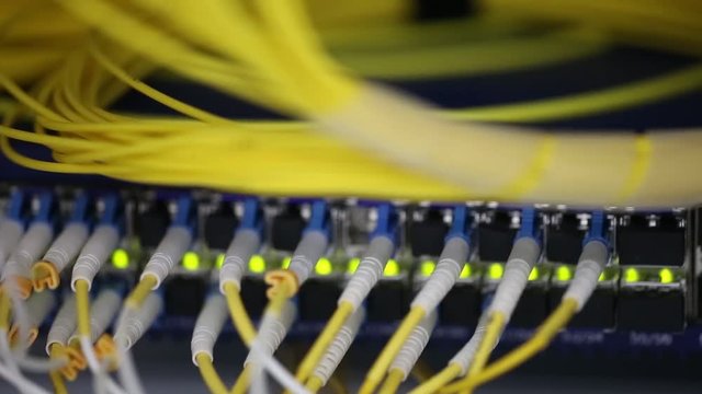 Server front side showing colorful switches and wiring Abstract blurred image for use as a background Close-up