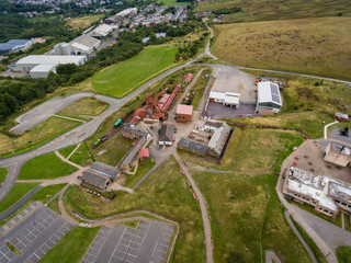 An aerial view of an Old Coal Mine Pit Yard on overcast Day, Blaenavon, Wales